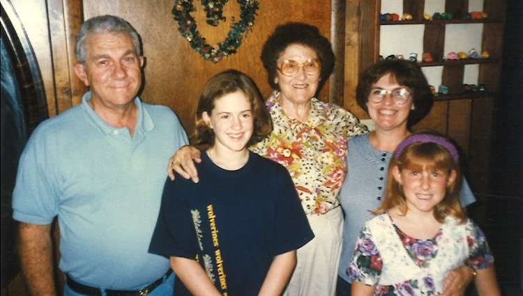 Family photo with Emily's mother, grandfather and great-grandmother who were all educators.