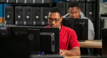 Two students using desktop computers