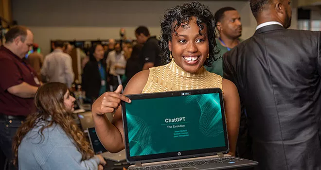 woman holding laptop