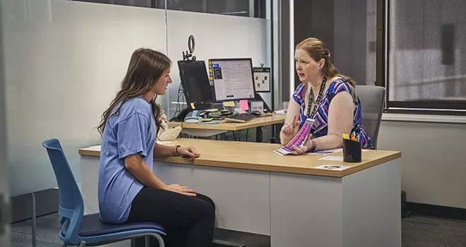 two people at desk