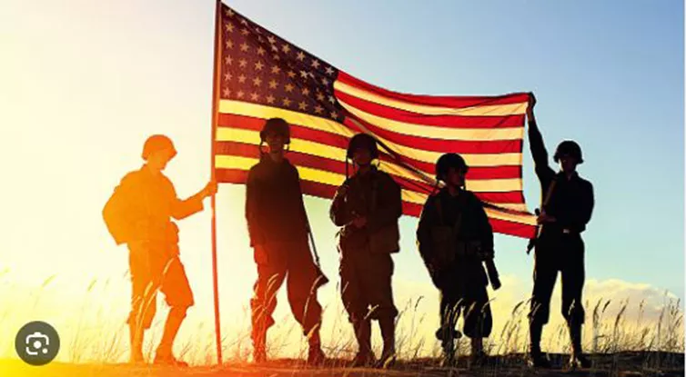 photo of American flag and veterans