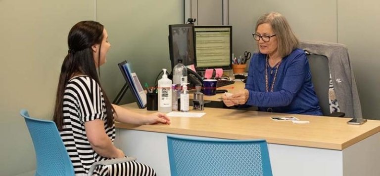 Student getting help with an Admission Counselor at TCC